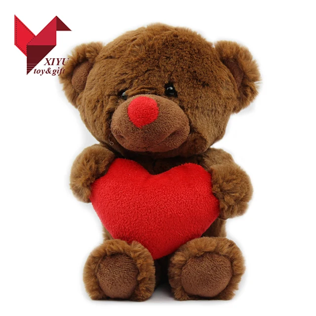 teddy bear plush toy with red heart as valentine gift