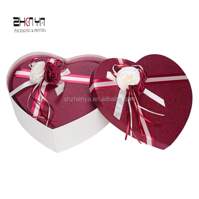 delicate beatiful heart shape gift box with flower ribbon