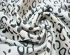 /product-detail/brand-new-imitation-animal-skin-embossed-fabric-of-new-structure-60649824791.html