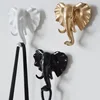 /product-detail/white-black-golden-life-look-creative-cute-beautiful-small-size-wall-mouted-resin-animal-cloth-key-hat-hook-62023330357.html