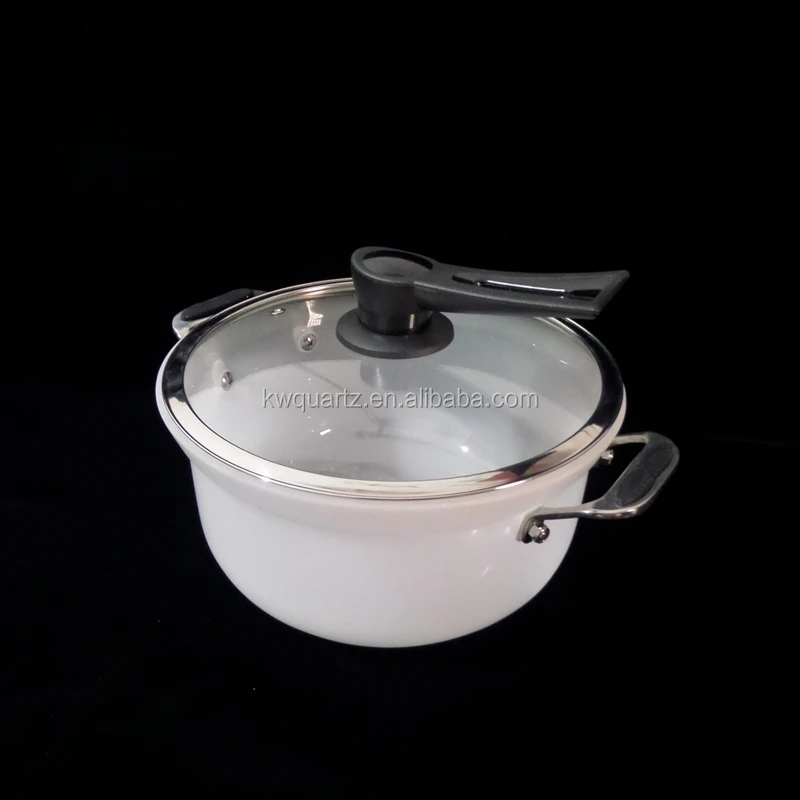 a chinese cooking utensil with green quartz stews.