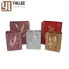 Red color gold foil stamping logo printed small coated art paper gift bag with handles
