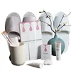Superior Quality hotel emenity set with disposable plastic hotel comb soap slippers shampoo dental kit