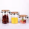 Customized Hermetic Airtight Round Glass Jar With Metal Clamp And Bamboo Lid For Food