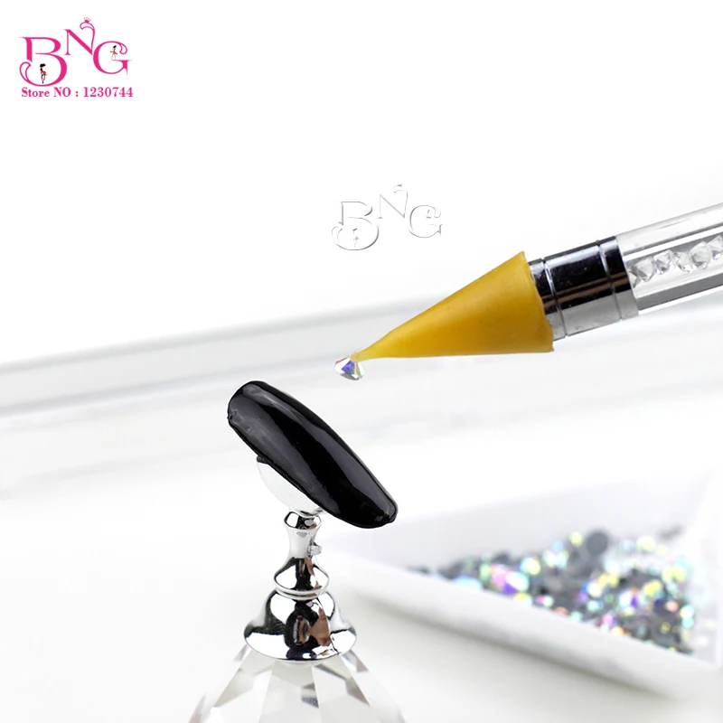 yellow wax pick up stone pen nail 