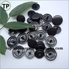 Black plastic snap button with four parts for clothing