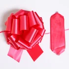 Solid color plastic ribbon with embossed bow for gift wrapping pom pom pull bow