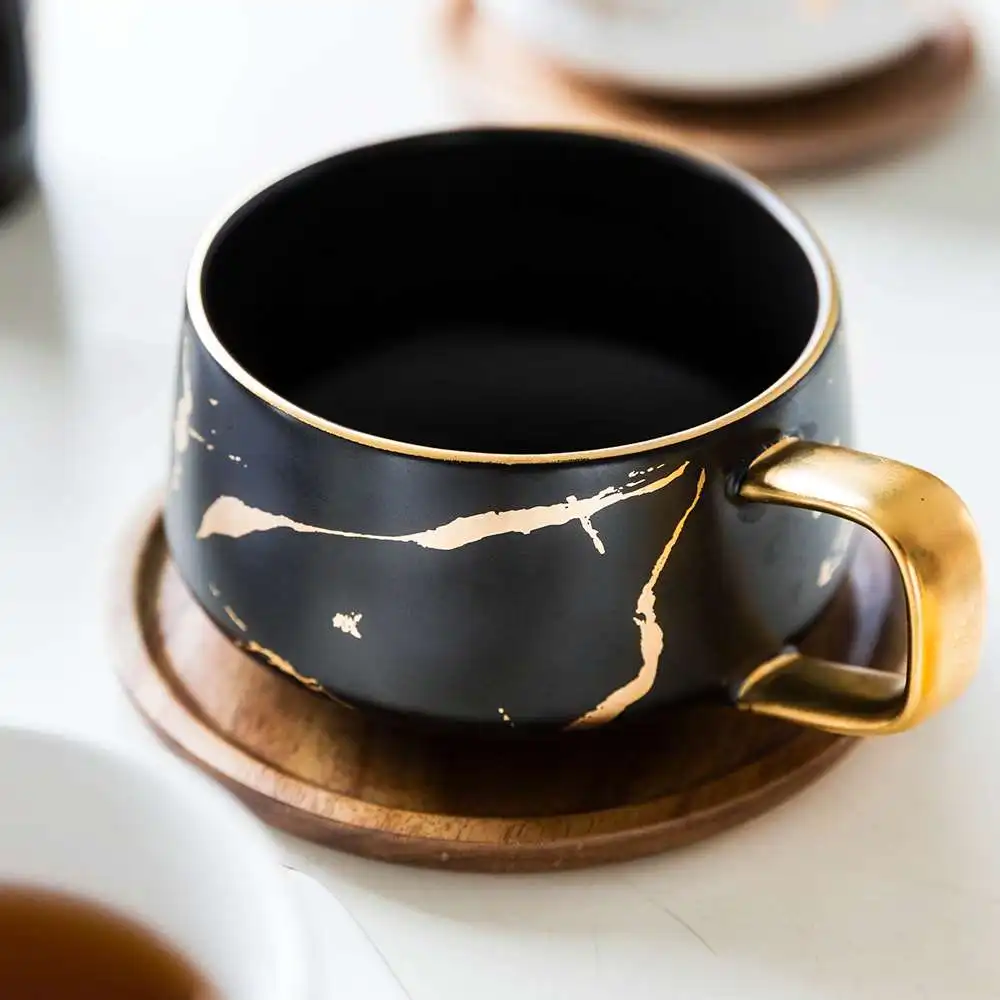 300ml Luxury Matte Ethiopian Tea Coffee Cups and With Wood Saucers Black and White Gold Inlay Ceramic Marble Cups, White black
300ml Luxury Matte Ethiopian Tea Coffee Cups and With Wood Saucers Black and White Gold Inlay Ceramic Marble Cups, White black