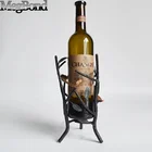 Metal bird on branch decorative wine display rack for table decor