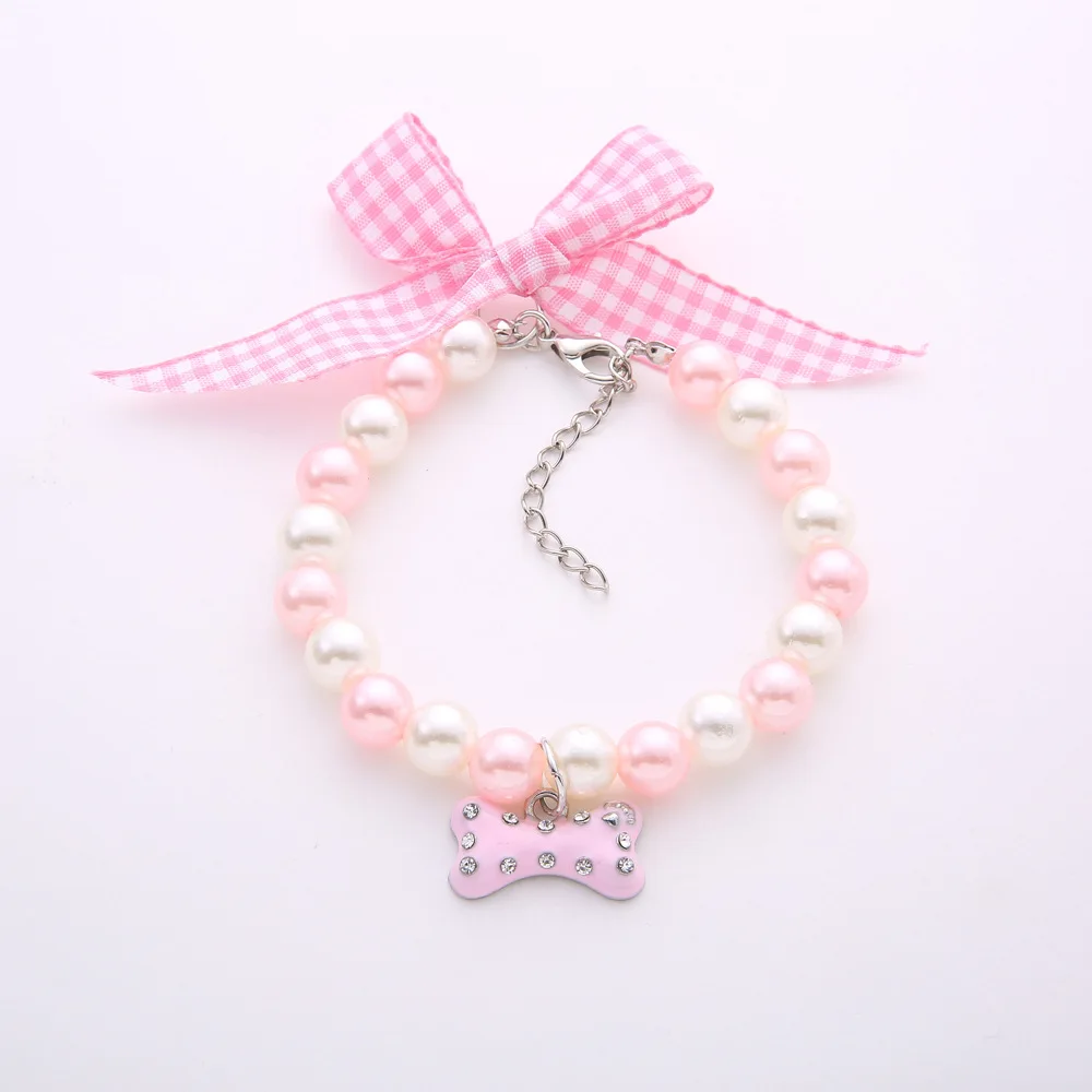 Pet accessories pet bone necklace bow 5 color pearl dog cat collar, As pictures 
Pet accessories pet bone necklace bow 5 color pearl dog cat collar, As pictures