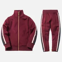 Stand up collar sport set with zip leg opening and side tape customize high street kids tracksuit sets
Stand up collar sport set with zip leg opening and side tape customize high street kids tracksuit sets