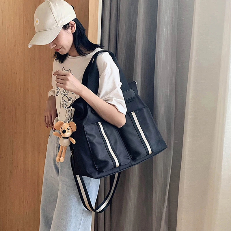 Large capacity light commuting Oxford cloth for women Single shoulder Leisure Tote canvas bag, Shown below
Large capacity light commuting Oxford cloth for women Single shoulder Leisure Tote canvas bag, Shown below