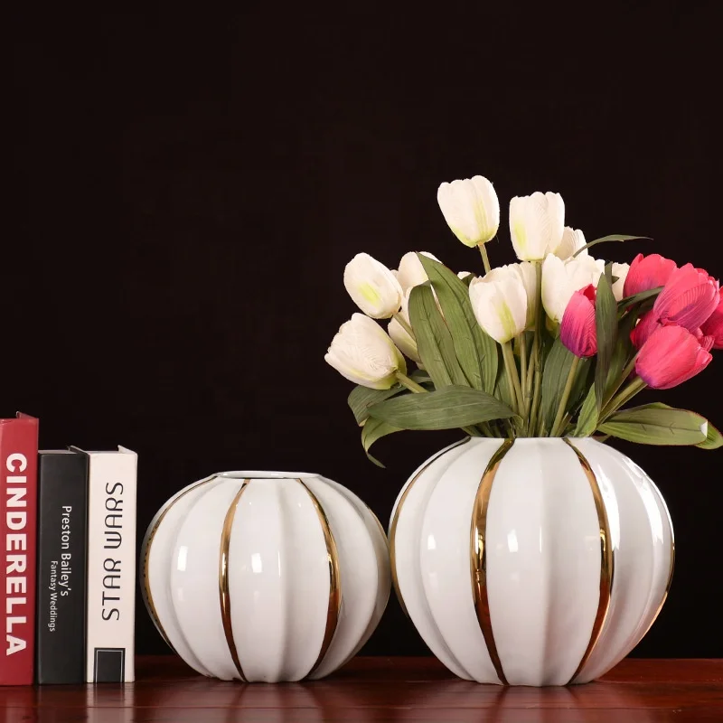 Spot low minimum order quantity modern light luxury white ceramic pumpkin vase gold line desktop ceramic Round decorative vase
Spot low minimum order quantity modern light luxury white ceramic pumpkin vase gold line desktop ceramic Round decorative vase