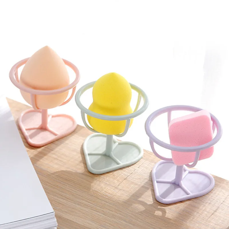 1Pc Makeup Puff Rack Sponge Holder Beauty Makeup Powder Puff Blender Storage Rack Sponge Drying Stand Holder Beauty Tool
1Pc Makeup Puff Rack Sponge Holder Beauty Makeup Powder Puff Blender Storage Rack Sponge Drying Stand Holder Beauty Tool