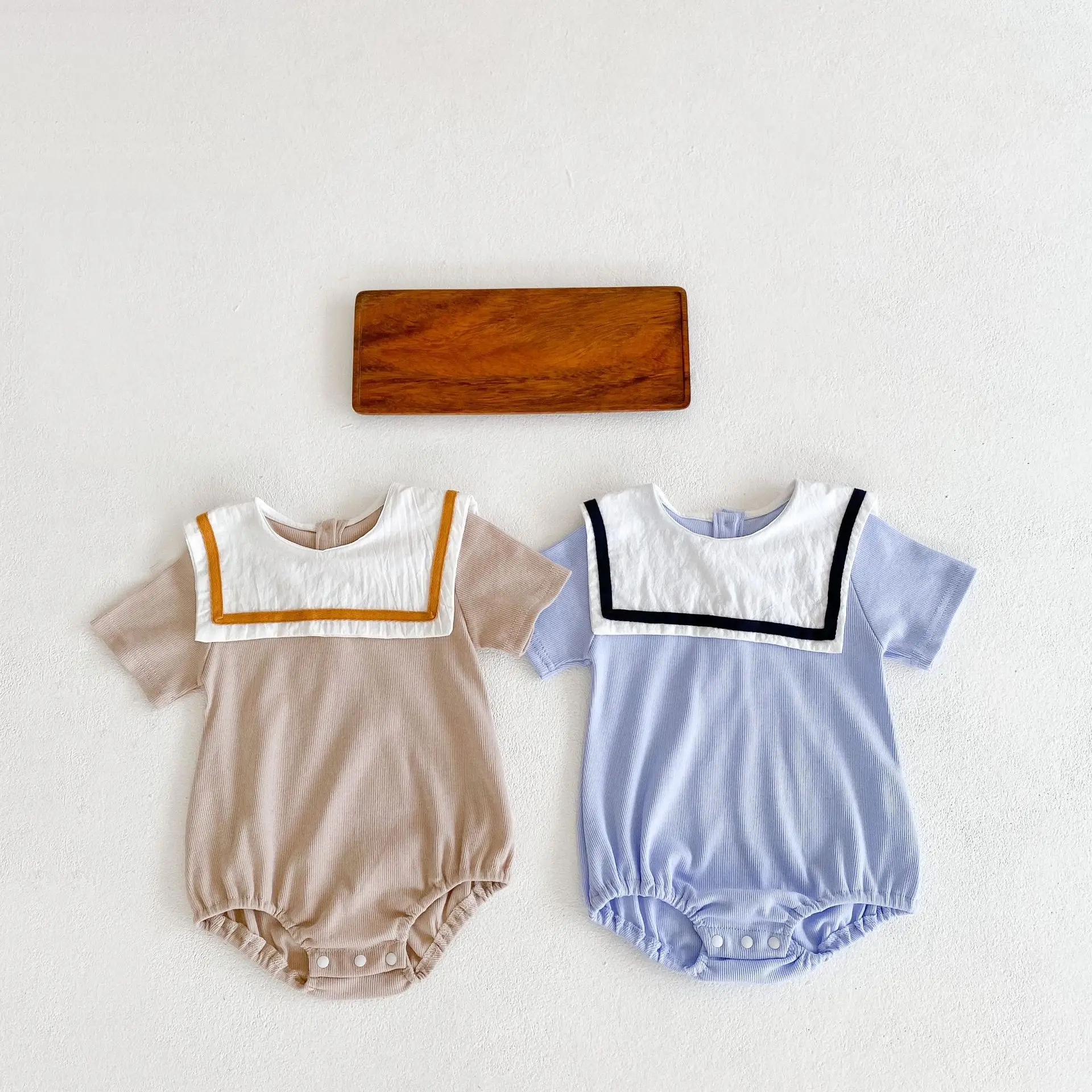 2021 Summer new design baby girl and baby boy children clothing wholesale navy collar short-sleeved fart-covered romper
2021 Summer new design baby girl and baby boy children clothing wholesale navy collar short-sleeved fart-covered romper