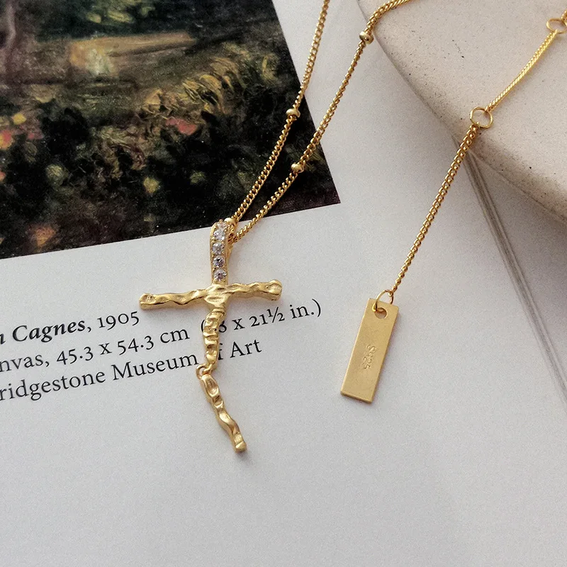 INS 925 Sterling Silver Gold Plated Irregular Crystal Cross Necklace, As shown in the picture
INS 925 Sterling Silver Gold Plated Irregular Crystal Cross Necklace, As shown in the picture