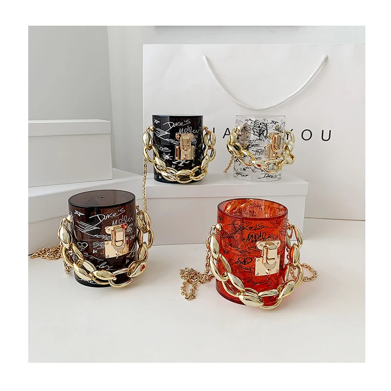 Golden Thick Chains Fashion Clear Acrylic Women's Handbag Designer Transparent Graffiti Letter Jelly Bags Female Mini Bag Purses
Golden Thick Chains Fashion Clear Acrylic Women's Handbag Designer Transparent Graffiti Letter Jelly Bags Female Mini Bag Purses