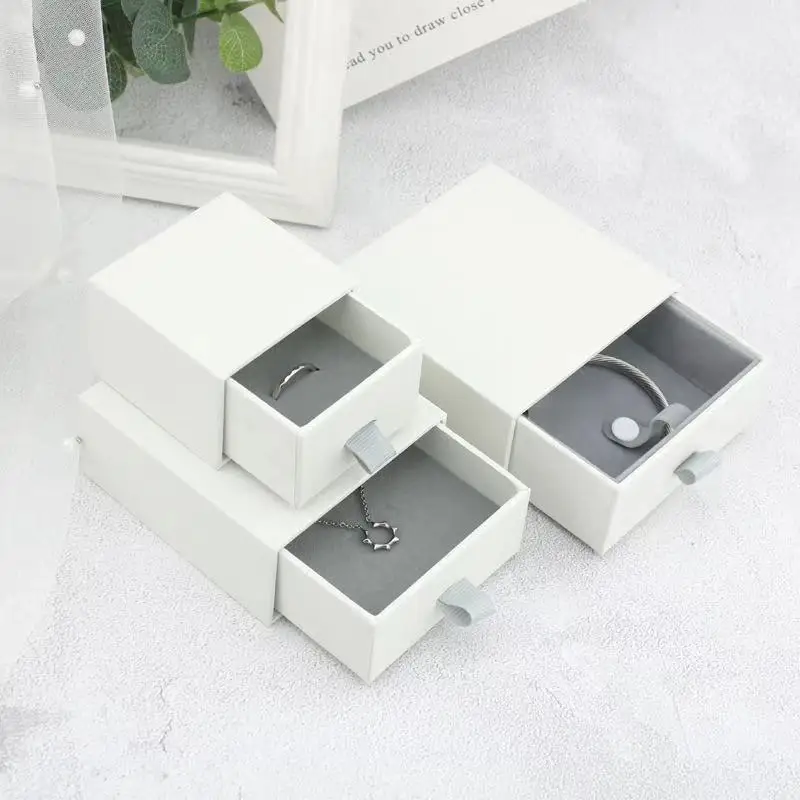 Wholesale punched paper jewelry packaging box ring ear stud earring box slide out-in drawer box for pendant necklace earrings, Gray and white
Wholesale punched paper jewelry packaging box ring ear stud earring box slide out-in drawer box for pendant necklace earrings, Gray and white