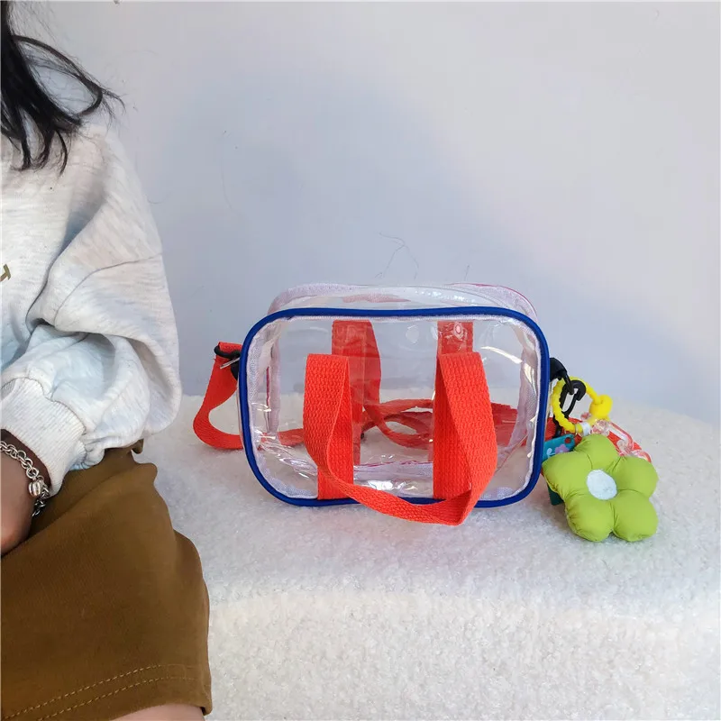 Ins summer new transparent flower pendant children's girls' mobile phones slung small bags for men and women tide
Ins summer new transparent flower pendant children's girls' mobile phones slung small bags for men and women tide