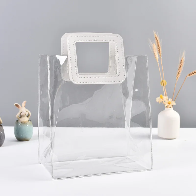 Hot Wholesale Clear Plastic Gift Bags with Leather Handle Reusable Handbag Transparent PVC Plastic Gift Wrap Tote Bag
Hot Wholesale Clear Plastic Gift Bags with Leather Handle Reusable Handbag Transparent PVC Plastic Gift Wrap Tote Bag