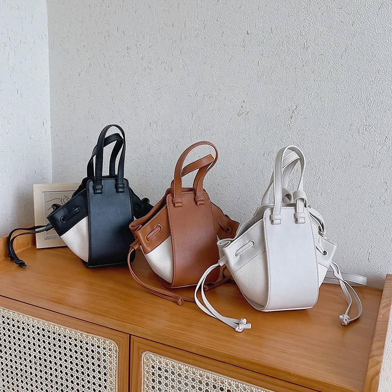 Creative design splicing Pu Canvas Bag New Single Shoulder Messenger Bag Fashion Bucket Handbags
Creative design splicing Pu Canvas Bag New Single Shoulder Messenger Bag Fashion Bucket Handbags