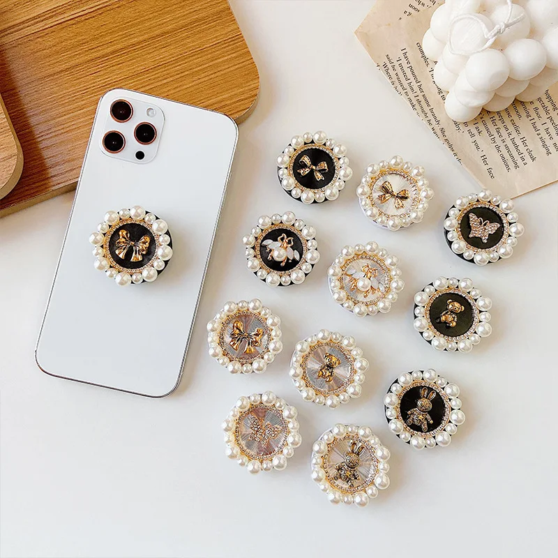 New Round Diamond and pearls Airbag Stand Electroplating Stand Lazy Desktop Mobile Phone Holder and Grip
New Round Diamond and pearls Airbag Stand Electroplating Stand Lazy Desktop Mobile Phone Holder and Grip