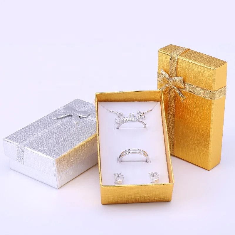Wholesale Small Jewelry Packaging Boxes Gold Jewelry Gift Packing Box with Ribbon 
Wholesale Small Jewelry Packaging Boxes Gold Jewelry Gift Packing Box with Ribbon