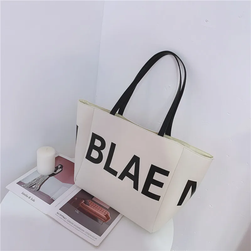 wholesale letter print designer lady tote hand bag private label trendy new 2021 big handbags for girls women
wholesale letter print designer lady tote hand bag private label trendy new 2021 big handbags for girls women