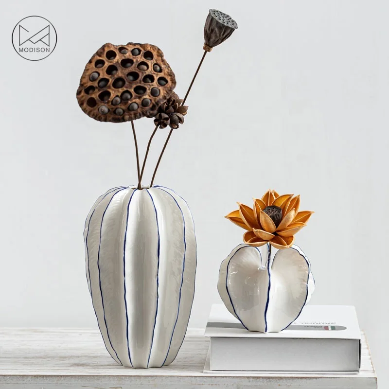 Modern white Ceramic Vase Carambola shape vase ,white nordic pottery, decorative flower pot
Modern white Ceramic Vase Carambola shape vase ,white nordic pottery, decorative flower pot