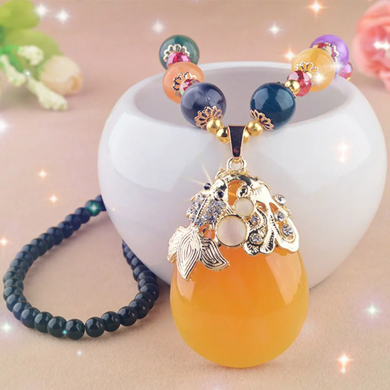 Colored beaded goldfish drop sweater chain rough stone beeswax lady long pendant necklace
Colored beaded goldfish drop sweater chain rough stone beeswax lady long pendant necklace