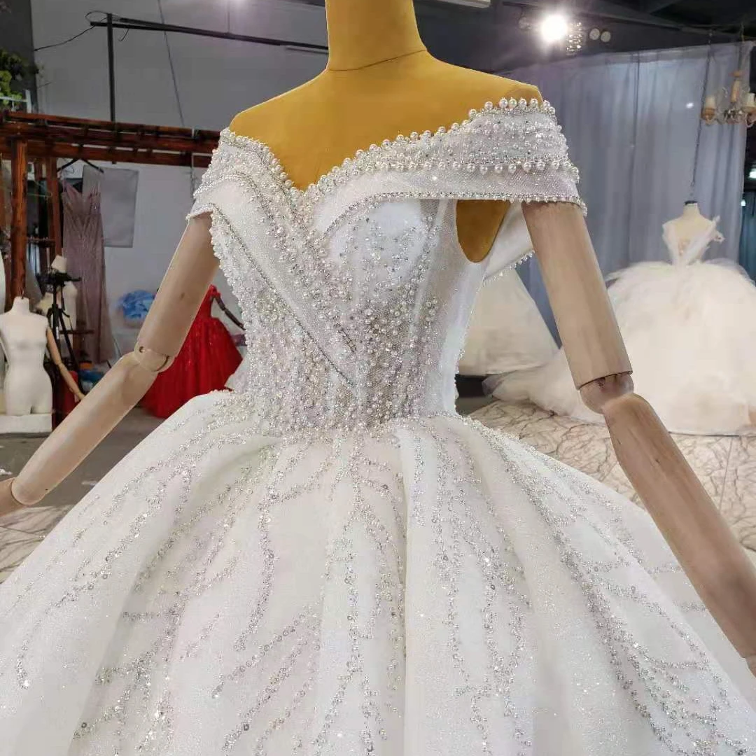Crystal Wholesale big bridal ball gown heavy bead lace ball gowns luxury dress wedding for women fashion dress long train, Custom made
Crystal Wholesale big bridal ball gown heavy bead lace ball gowns luxury dress wedding for women fashion dress long train, Custom made