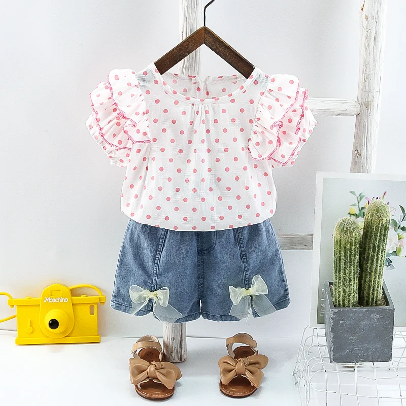 Clothing wholesale girl layered butterfly sleeve woven cotton round neck polka dot top and elastic bow denim shorts set, Picture
Clothing wholesale girl layered butterfly sleeve woven cotton round neck polka dot top and elastic bow denim shorts set, Picture