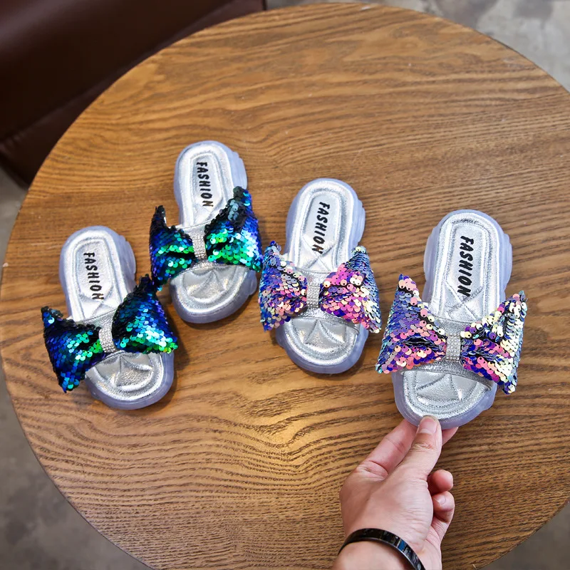 Fashion Kids Girls Outdoor Glitter Bling Bow Slides Sandals Slippers Summer Soft PVC Jelly Slippers Shoes Manufacturer, Colors
Fashion Kids Girls Outdoor Glitter Bling Bow Slides Sandals Slippers Summer Soft PVC Jelly Slippers Shoes Manufacturer, Colors