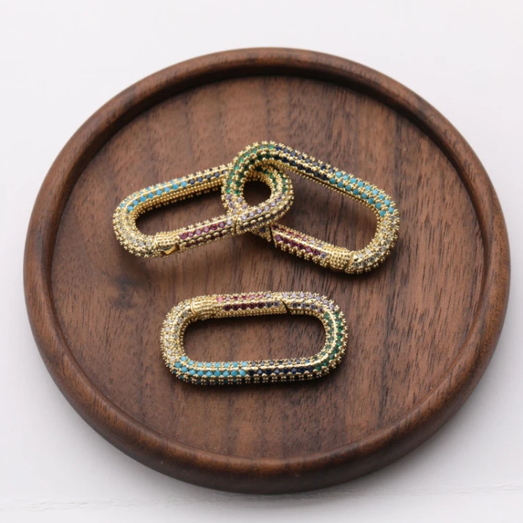 High Quality CZ Micro Pave Multi Color Oval Shaped Clasp Carabiner Gold Plated Pendant for Necklace Jewelry Making
High Quality CZ Micro Pave Multi Color Oval Shaped Clasp Carabiner Gold Plated Pendant for Necklace Jewelry Making