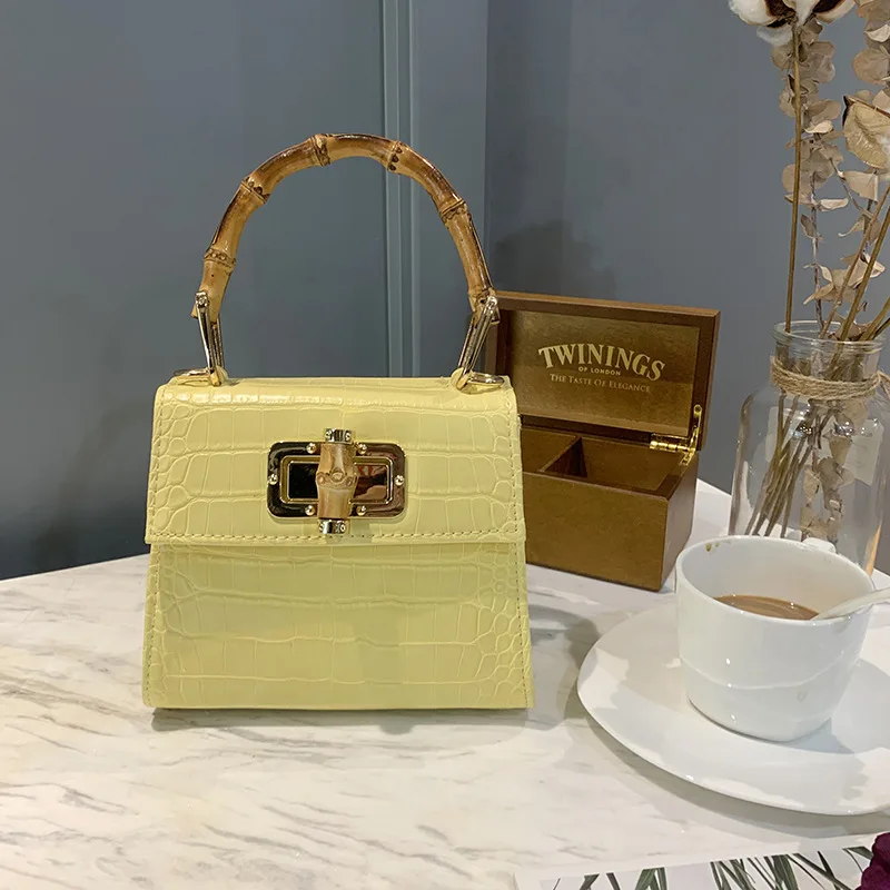 2021 Summer Style Girls Bamboo Top Handle PU Leather Mobile Phone Bag Pouch Crossbody Bag Purse Small Shoulder Bag For Women
2021 Summer Style Girls Bamboo Top Handle PU Leather Mobile Phone Bag Pouch Crossbody Bag Purse Small Shoulder Bag For Women