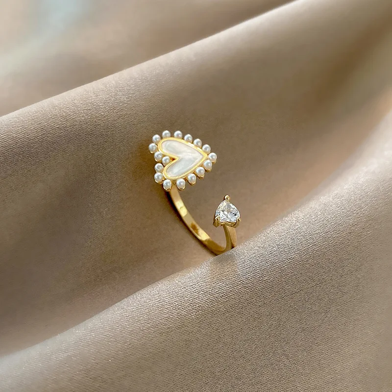 Elegant 18k Gold Plated Pearl Heart Shaped Finger Ring Adjustable White Enamel Heart Opening Ring
Elegant 18k Gold Plated Pearl Heart Shaped Finger Ring Adjustable White Enamel Heart Opening Ring