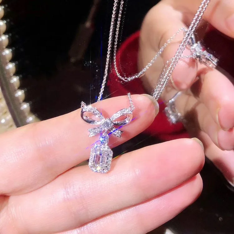 Luxury women jewerly high end brass silver plated bow micro inlay colorful zircon pendant necklace, As the pic show 
Luxury women jewerly high end brass silver plated bow micro inlay colorful zircon pendant necklace, As the pic show