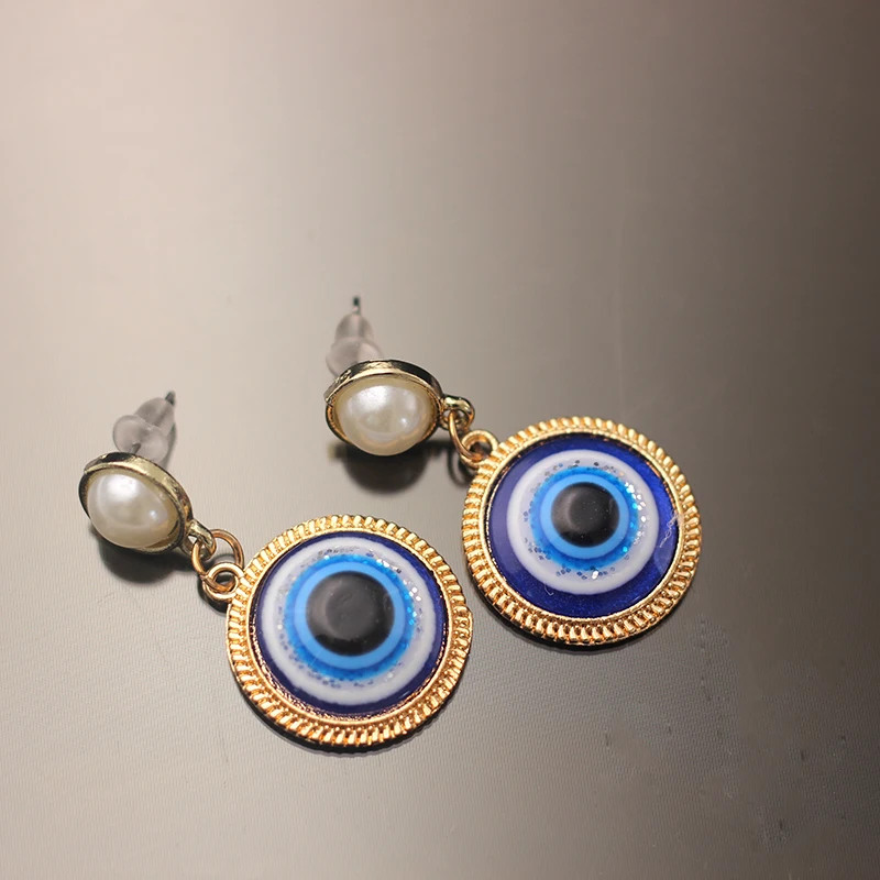 Manufacturer Of Custom Alloy Plated Gold Round Evil Eye Pearl Devil's Eye Earrings Of Woman, Blue color
Manufacturer Of Custom Alloy Plated Gold Round Evil Eye Pearl Devil's Eye Earrings Of Woman, Blue color