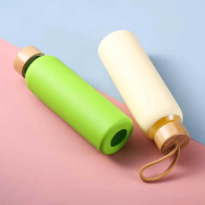 Eco-friendly Amazon Creative glass with rope wooden lid solid color silicone sleeve protective glass bottle
Eco-friendly Amazon Creative glass with rope wooden lid solid color silicone sleeve protective glass bottle