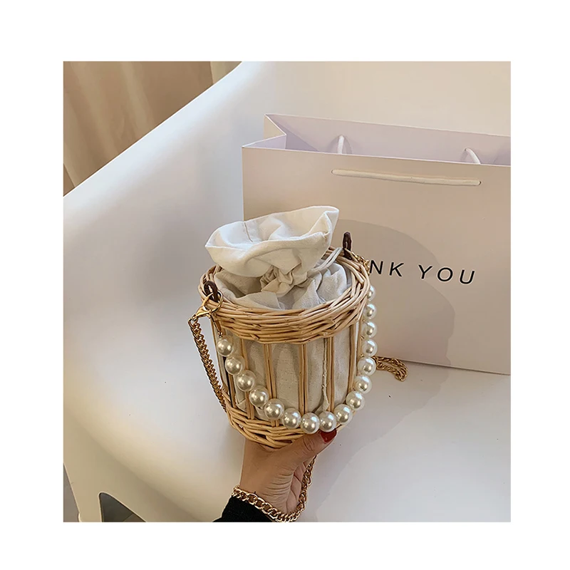 2021 Summer Chain Crossbody Bag Korea Pearl Handle Woven Hollow Bucket Straw Purse and Handbag For Women Beach Rattan Hand Bags
2021 Summer Chain Crossbody Bag Korea Pearl Handle Woven Hollow Bucket Straw Purse and Handbag For Women Beach Rattan Hand Bags