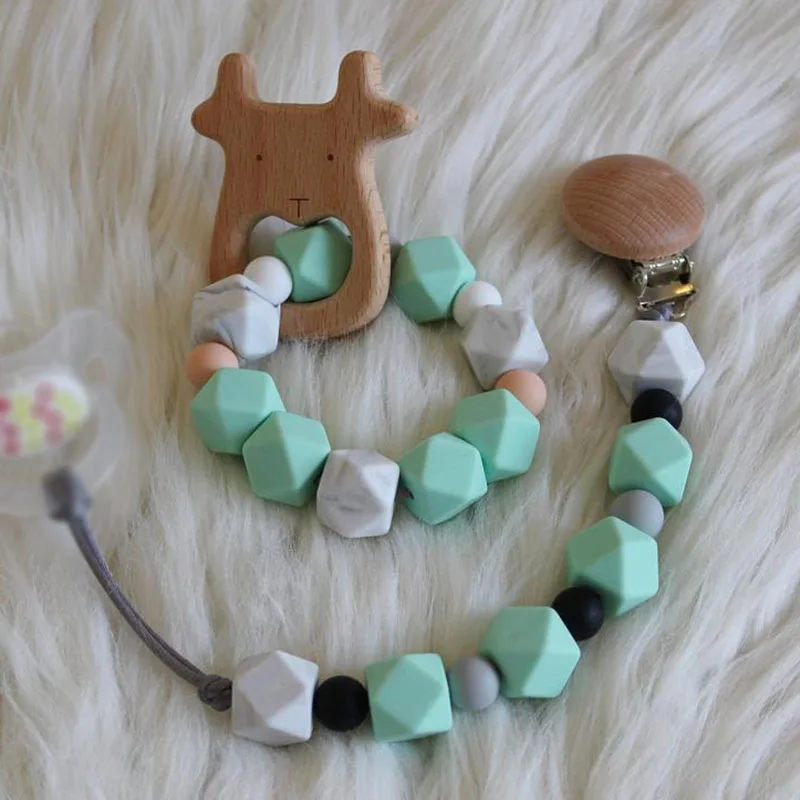 Wholesale Silicone Beads Infant Teething Sensory Nipple Holder Chain Silicone Wooden Baby Bracelet 
Wholesale Silicone Beads Infant Teething Sensory Nipple Holder Chain Silicone Wooden Baby Bracelet