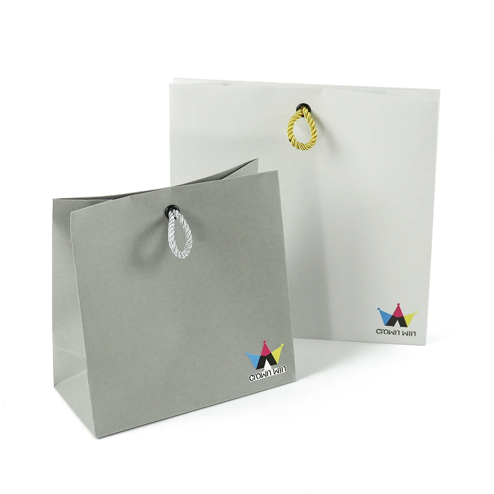 Elegant Clothing Packaging Business Paper Bags 250 Gsm Grey Craft Stand Up Bags Brown Satin Punch Hole Shopping Paper Bag
Elegant Clothing Packaging Business Paper Bags 250 Gsm Grey Craft Stand Up Bags Brown Satin Punch Hole Shopping Paper Bag