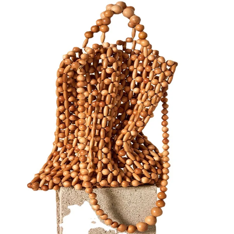 Hot sell good quality wooden bead natural handmade retro bambbo shoulder handbag hollow tote beach bag
Hot sell good quality wooden bead natural handmade retro bambbo shoulder handbag hollow tote beach bag
