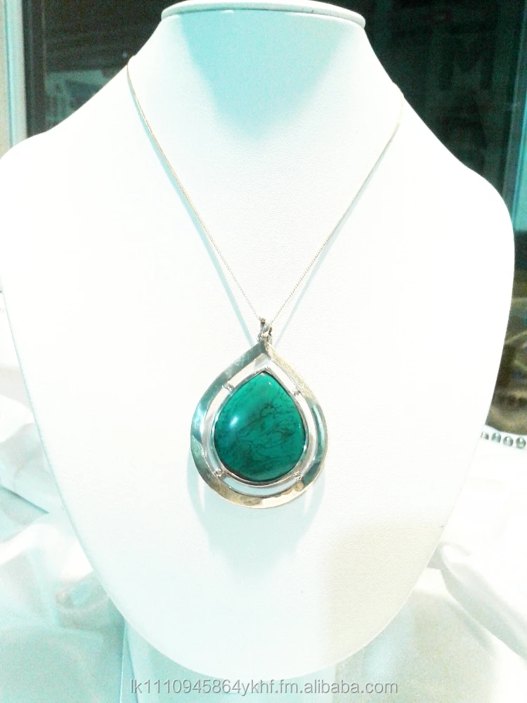 Silver pendant set with turquoise