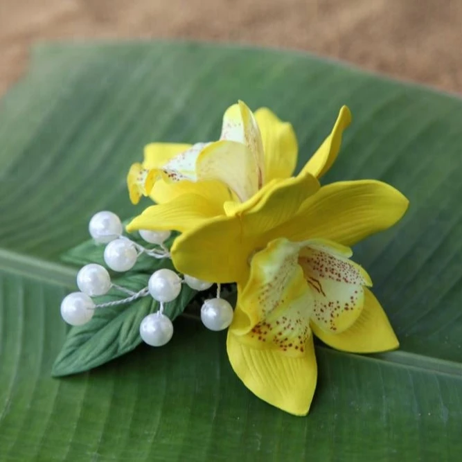Colorful Natural Look Cymbidium With White Pearl On Black Plastic