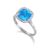 One Lovely Ladies 14 K White Gold Diamond Ring Contains spectacular cushion Blue Topaz measuring an impressive 8X8 2.40