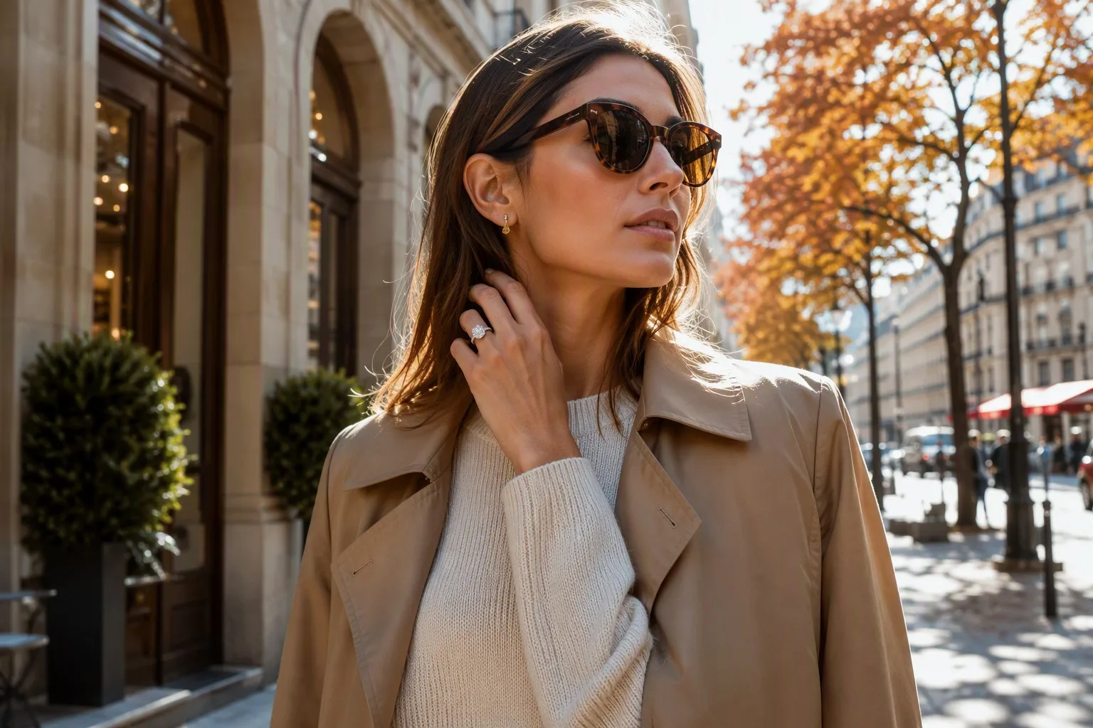 Elegant woman wearing a large lab-grown diamond solitaire ring in a city setting