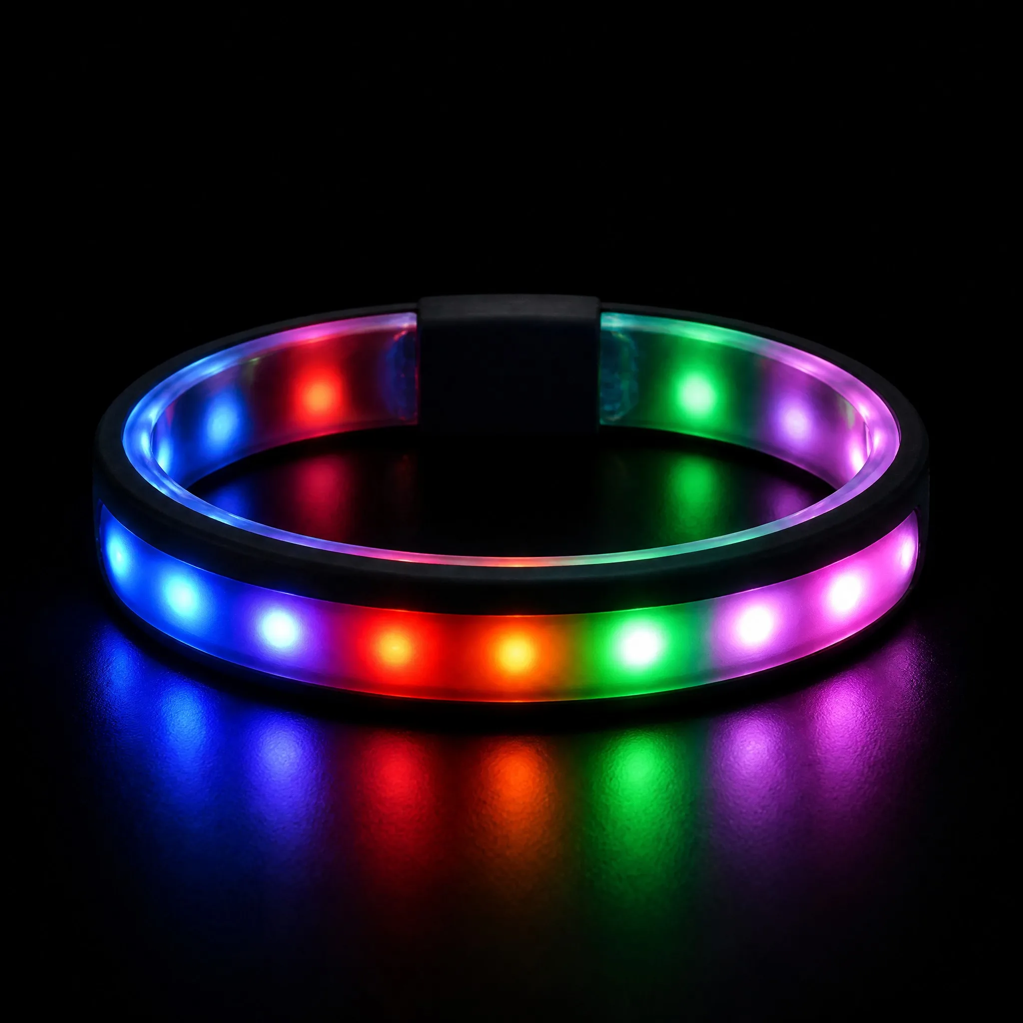 LED silicone bracelet glowing with multicolor lights in a dark environment