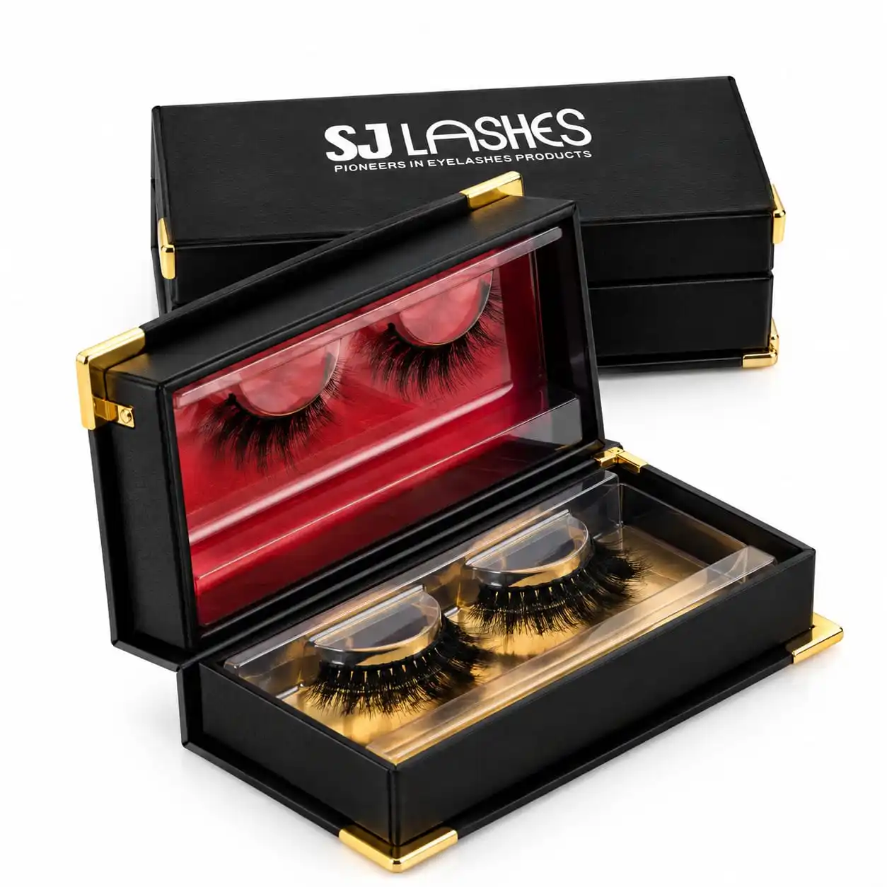 Black bifold lash gift box with gold corner protectors and gold hinges, open to show a red velvet lid insert and a gold base insert, each holding a lash pair - black and gold lash gift box