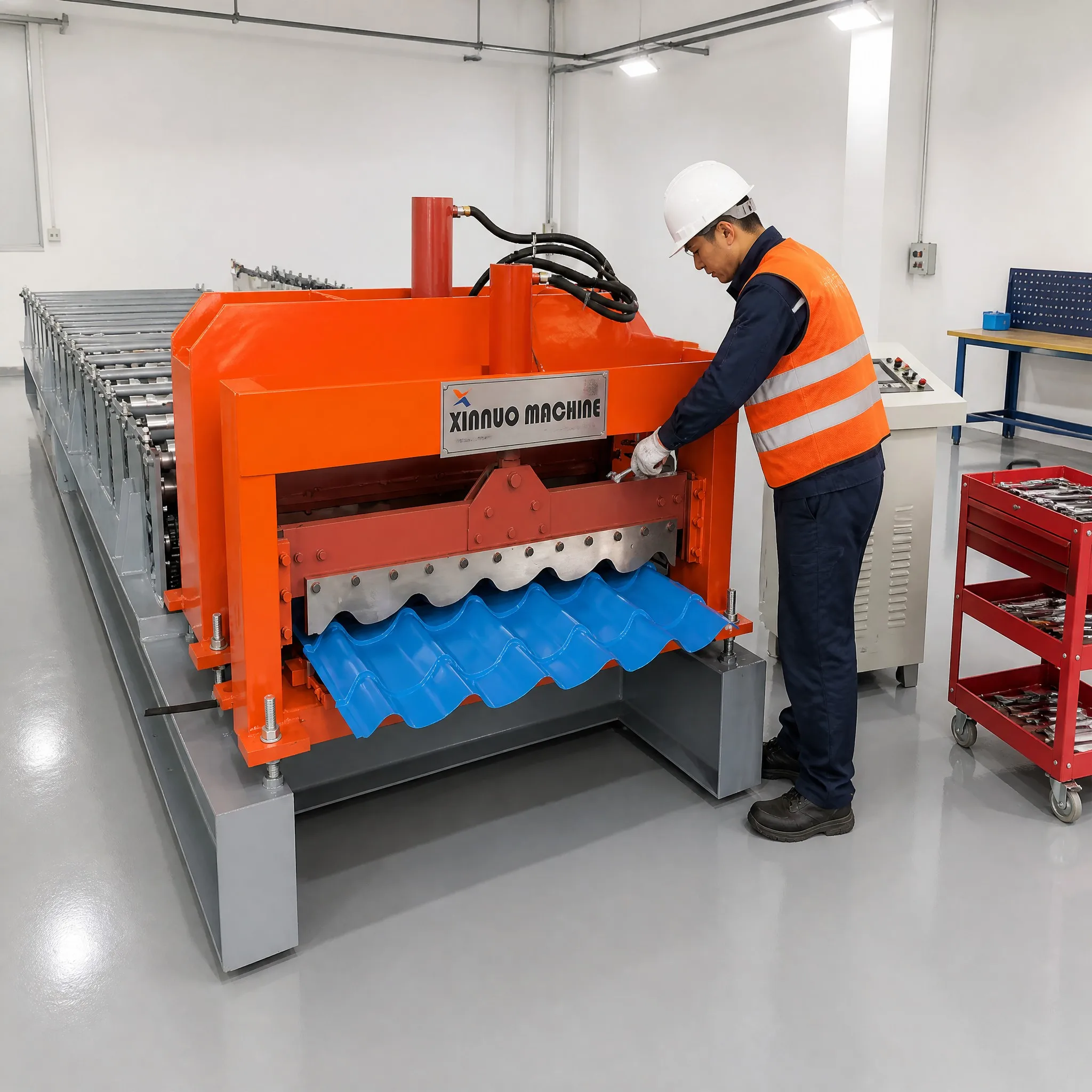 Front view of the Xinnuo glazed tile forming machine during workshop commissioning